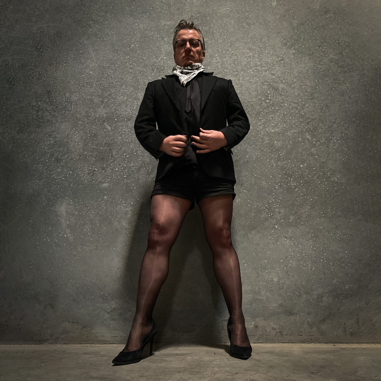Paul Duane / aka Soul Anarchist, in his signature tailored shorts suit, pantyhose and heels.