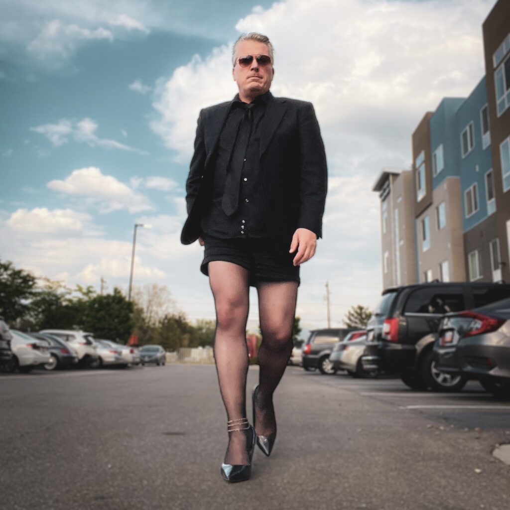 Paul Duane, Progressive House DJ & host of the Soul Anarchist Podcast, dressed in his signature shorts suit, pantyhose and heels.